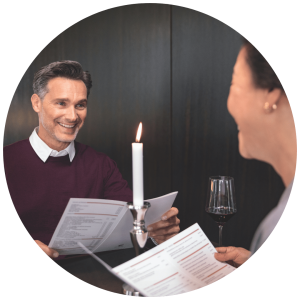 Man and women eating at restaurant